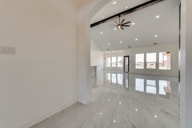 12045 W Palomino Ave, Odessa, TX 79764 - empty room with high vaulted ceiling, light marble finish floors, ceiling fan, beam ceiling, and recessed lighting
