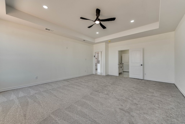 12045 W Palomino Ave, Odessa, TX 79764 - unfurnished bedroom with a raised ceiling, carpet flooring, recessed lighting, and a ceiling fan
