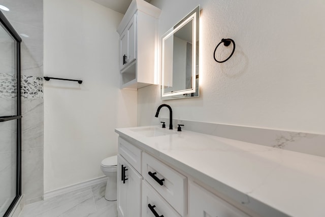 12045 W Palomino Ave, Odessa, TX 79764 - bathroom featuring marble finish flooring, vanity, and a shower with door