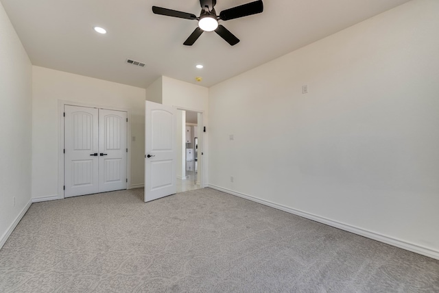 12045 W Palomino Ave, Odessa, TX 79764 - unfurnished bedroom with light colored carpet, recessed lighting, a closet, and ceiling fan