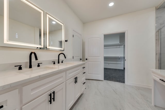 12045 W Palomino Ave, Odessa, TX 79764 - full bathroom with double vanity, marble finish floors, recessed lighting, a spacious closet, and a shower