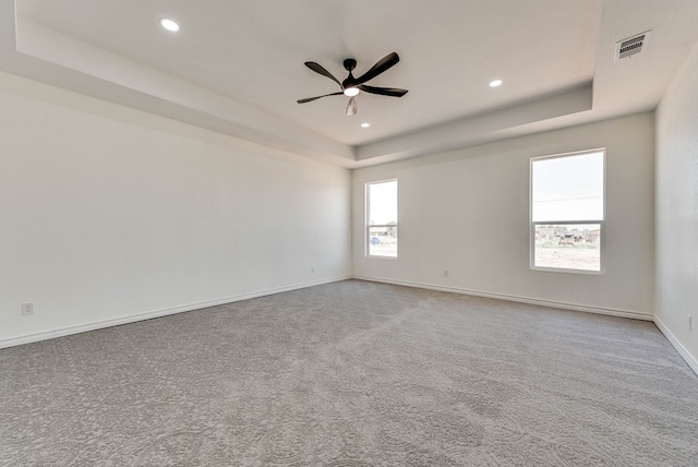 12045 W Palomino Ave, Odessa, TX 79764 - carpeted spare room featuring a raised ceiling, ceiling fan, and recessed lighting