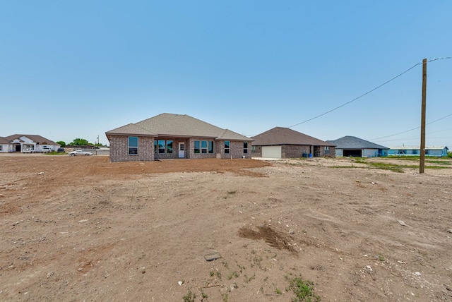 12045 W Palomino Ave, Odessa, TX 79764 - view of front of home featuring brick siding