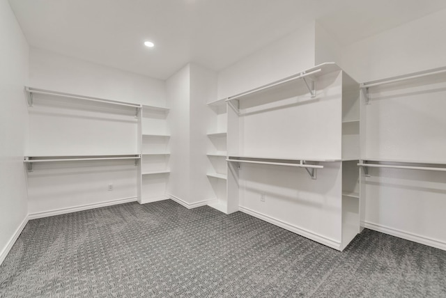 12045 W Palomino Ave, Odessa, TX 79764 - walk in closet featuring dark colored carpet