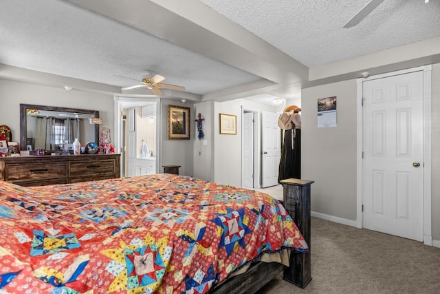 5714 Ector Ave, Odessa, TX 79714 - bedroom with a textured ceiling, carpet floors, a ceiling fan, and connected bathroom