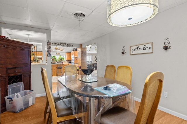 5714 Ector Ave, Odessa, TX 79714 - dining area with light wood-type flooring and a paneled ceiling