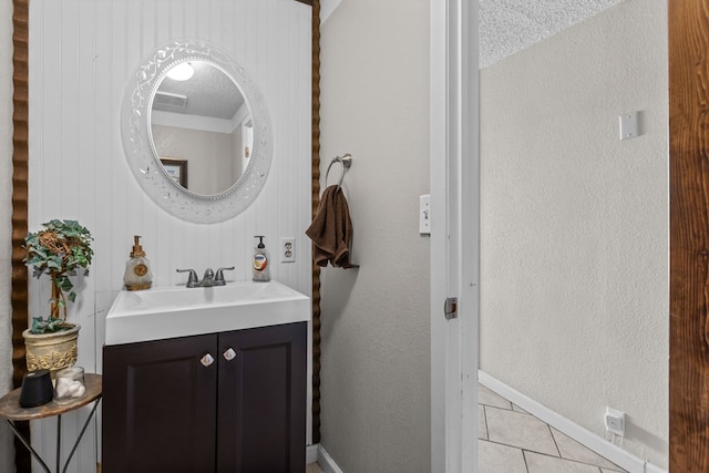 5714 Ector Ave, Odessa, TX 79714 - bathroom featuring tile patterned flooring, vanity, and a textured ceiling