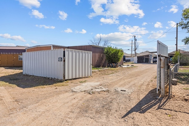 5714 Ector Ave, Odessa, TX 79714 - view of dirt / gravel driveway with a gated entry