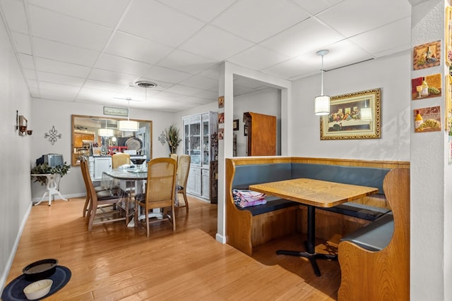 5714 Ector Ave, Odessa, TX 79714 - dining space with breakfast area, a paneled ceiling, and wood finished floors