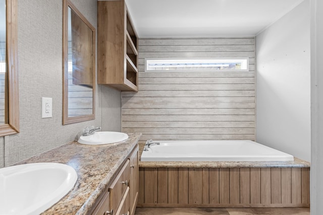 5714 Ector Ave, Odessa, TX 79714 - bathroom with a garden tub and double vanity