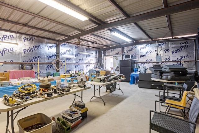 5714 Ector Ave, Odessa, TX 79714 - miscellaneous room featuring unfinished concrete floors and a workshop area