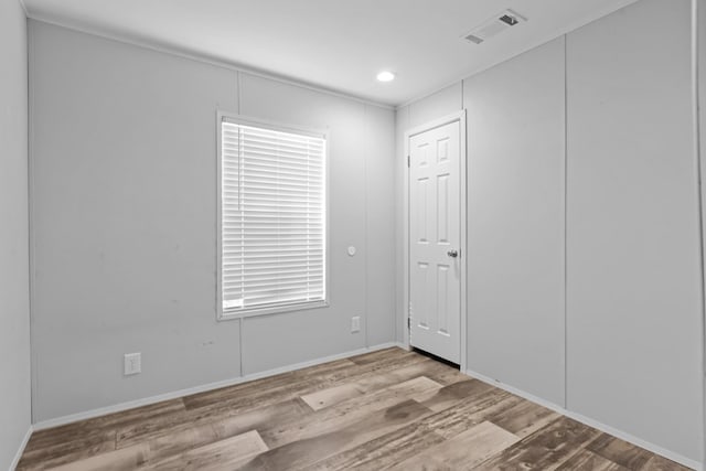 5714 Ector Ave, Odessa, TX 79714 - unfurnished room with wood finished floors and recessed lighting