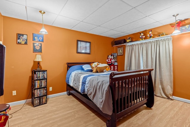 5714 Ector Ave, Odessa, TX 79714 - bedroom with a drop ceiling and wood finished floors