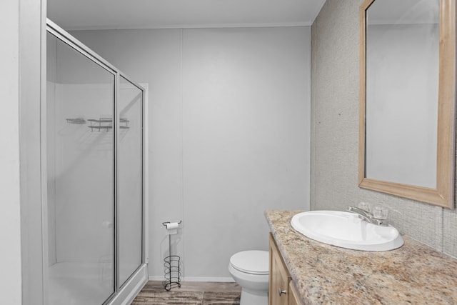5714 Ector Ave, Odessa, TX 79714 - full bath with vanity, a stall shower, and wood finished floors