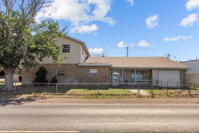 5714 Ector Ave, Odessa, TX 79714 - view of front of property featuring brick siding, an attached garage, a fenced front yard, and roof with shingles