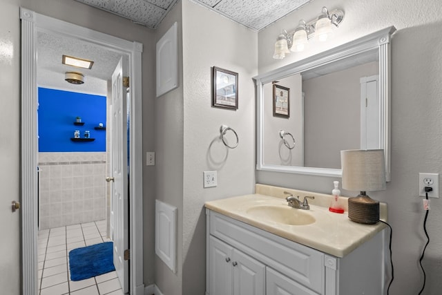 5714 Ector Ave, Odessa, TX 79714 - bathroom with tile patterned flooring and vanity