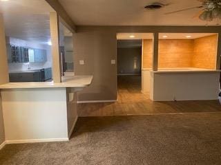 906 S Franklin Ave, Monahans, TX 79756 - kitchen with carpet floors, baseboards, and a ceiling fan