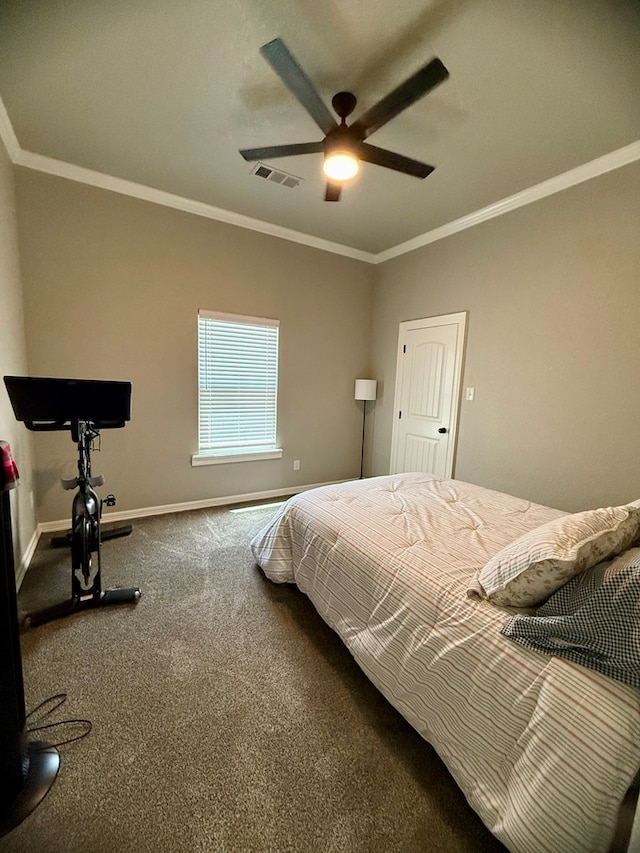 bedroom featuring visible vents, crown molding, ceiling fan, carpet floors, and baseboards