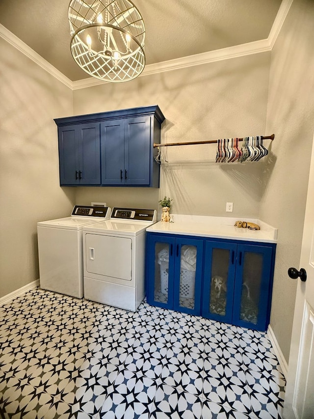 laundry area featuring cabinet space, tile patterned floors, washer and dryer, and baseboards
