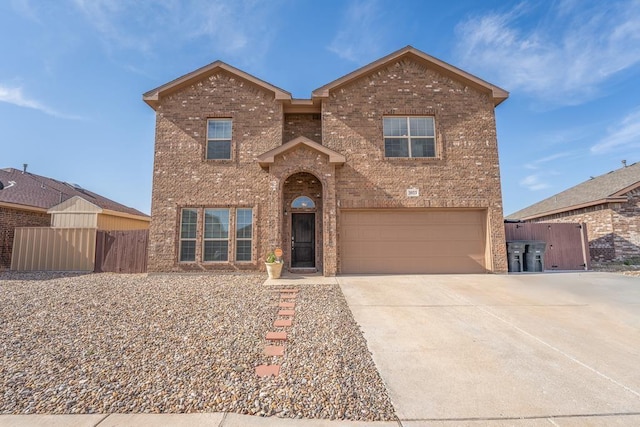 3923 Roma St, Odessa, TX 79765 - traditional-style house featuring brick siding, an attached garage, and driveway