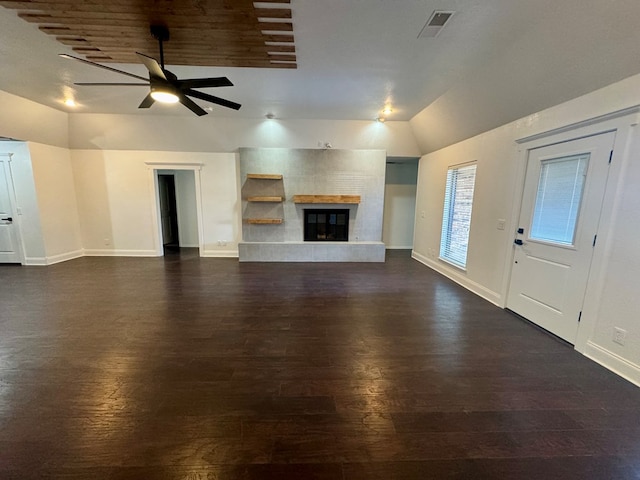 4612 Fountain Ln, Odessa, TX 79761 - unfurnished living room with lofted ceiling, dark wood-style floors, ceiling fan, and a tiled fireplace