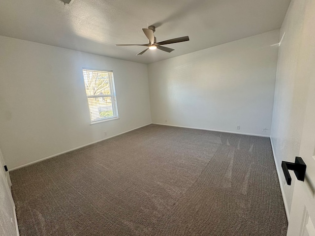 4612 Fountain Ln, Odessa, TX 79761 - empty room featuring dark carpet and a ceiling fan