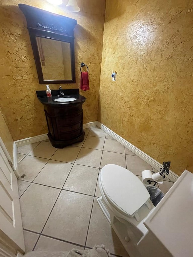 3934 N Bucknell Ave, Odessa, TX 79764 - bathroom featuring tile patterned floors, vanity, toilet, and baseboards