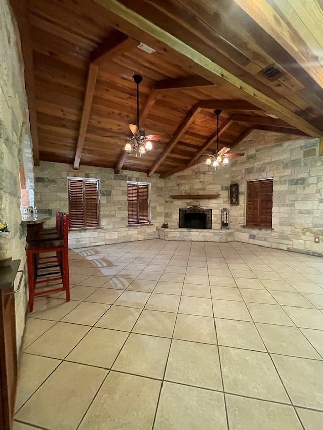 3934 N Bucknell Ave, Odessa, TX 79764 - unfurnished living room with ceiling fan, wooden ceiling, an outdoor stone fireplace, and light tile patterned floors