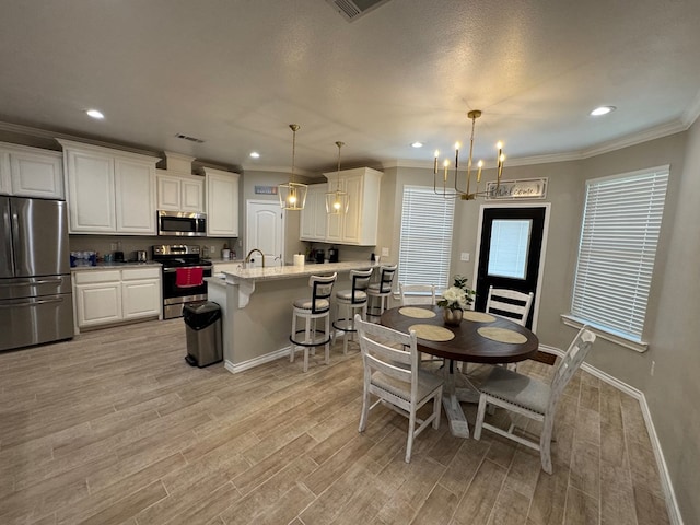 1715 Morgan Way, Midland, TX 79705 - dining space with light wood finished floors, a chandelier, recessed lighting, and crown molding