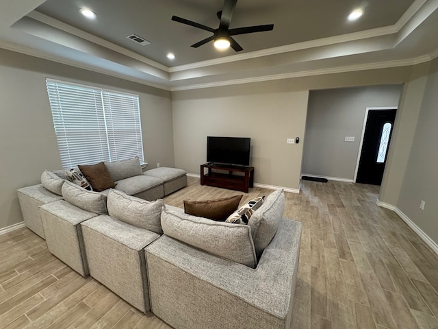 1715 Morgan Way, Midland, TX 79705 - living area featuring a raised ceiling, light wood-type flooring, a ceiling fan, and crown molding