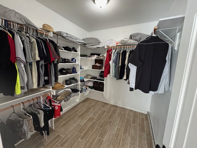 1715 Morgan Way, Midland, TX 79705 - spacious closet featuring wood finished floors