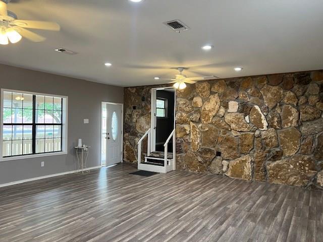 unfurnished living room with stairs, recessed lighting, ceiling fan, and wood finished floors