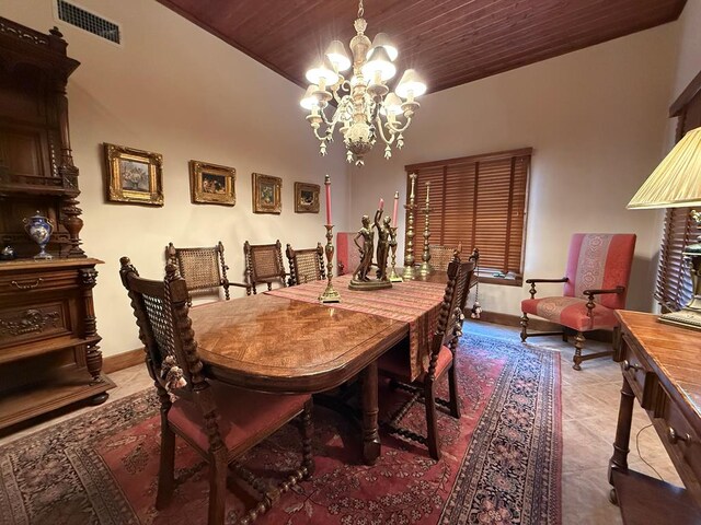 tiled dining room with wood ceiling and a notable chandelier