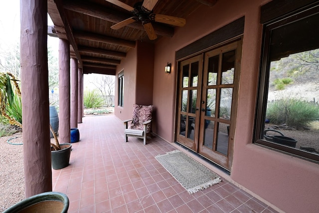 view of patio / terrace featuring ceiling fan and french doors