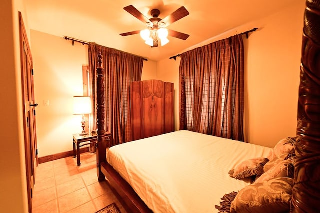 bedroom featuring ceiling fan and light tile patterned floors