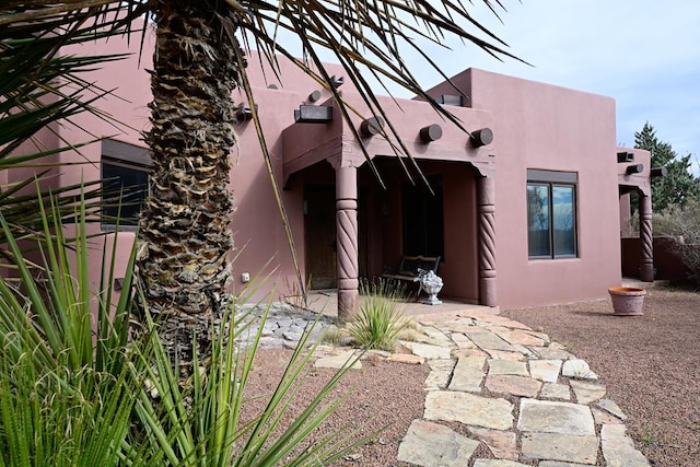 doorway to property featuring a patio area