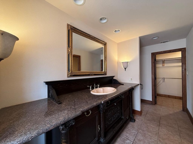 bathroom featuring vanity and tile patterned flooring