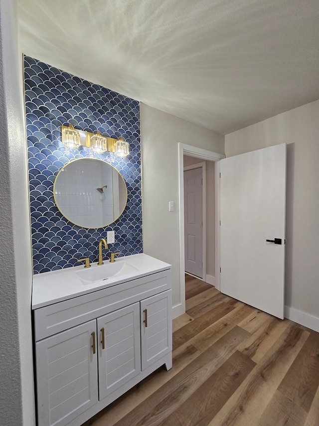 2500 Roper St, Odessa, TX 79761 - bathroom featuring vanity and wood finished floors