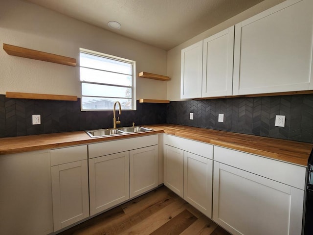 2500 Roper St, Odessa, TX 79761 - kitchen featuring wood counters, open shelves, and wood finished floors