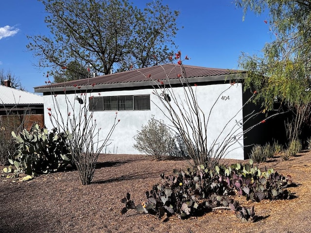 404 N Plateau St, Marfa, TX 79843 - view of property exterior featuring stucco siding