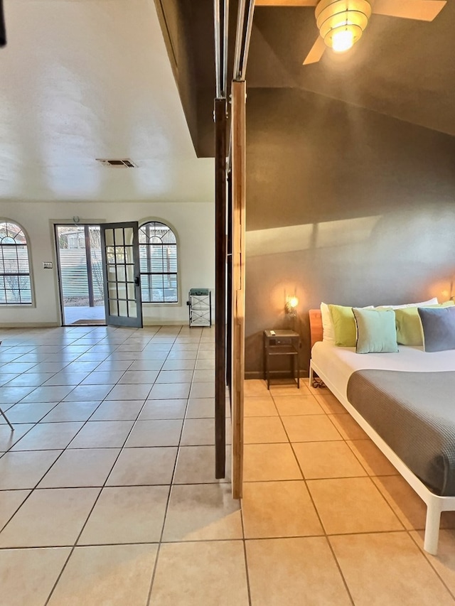 404 N Plateau St, Marfa, TX 79843 - bedroom with light tile patterned floors, access to exterior, and a ceiling fan