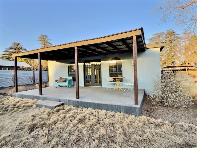404 N Plateau St, Marfa, TX 79843 - view of patio featuring french doors and fence