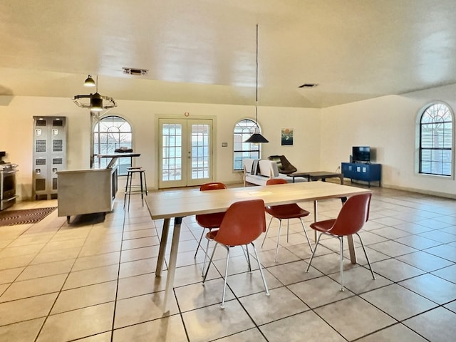 404 N Plateau St, Marfa, TX 79843 - dining area featuring french doors and light tile patterned flooring