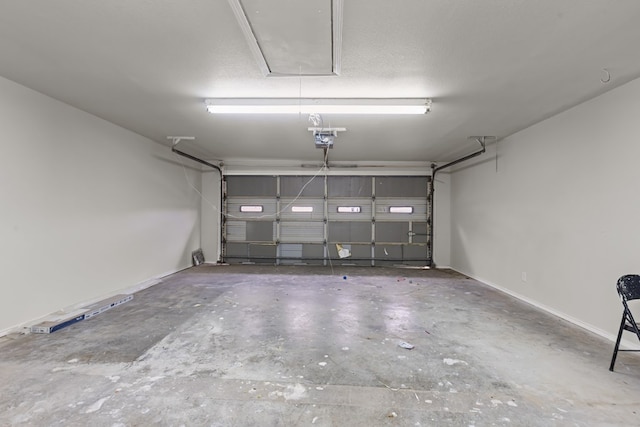 622 W Hillmont Rd, Odessa, TX 79764 - garage with a garage door opener and baseboards