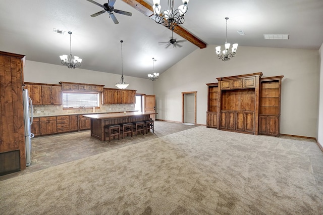 7101 W County Rd 44, Midland, TX 79707 - kitchen featuring freestanding refrigerator, a chandelier, a ceiling fan, beamed ceiling, and high vaulted ceiling