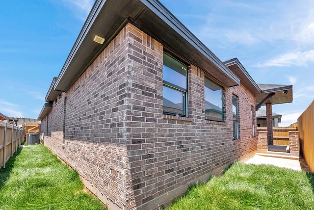 8634 Luz Dr, Odessa, TX 79765 - view of property exterior featuring brick siding and cooling unit