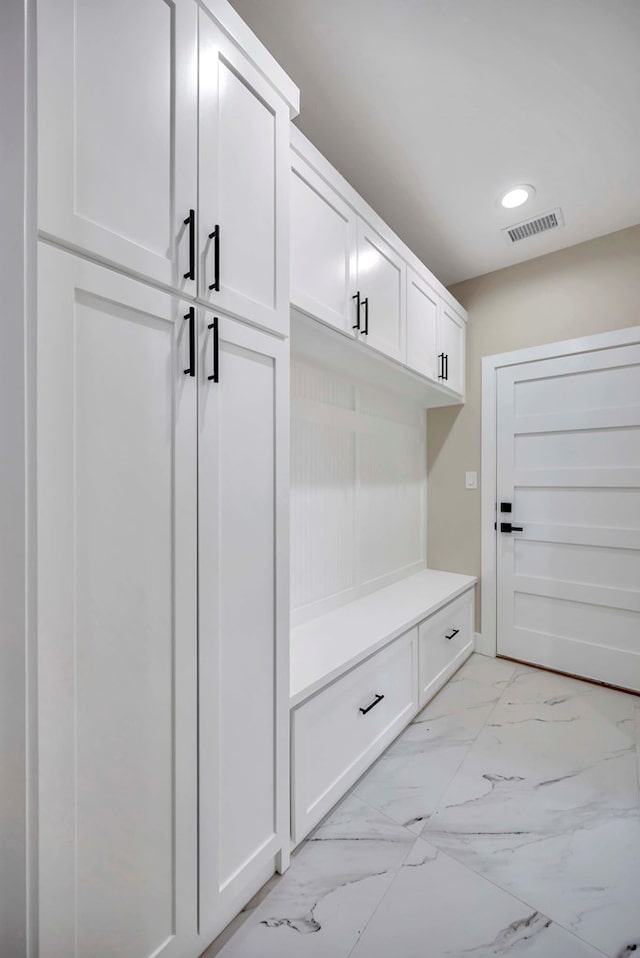 8634 Luz Dr, Odessa, TX 79765 - mudroom featuring light marble finish flooring and recessed lighting