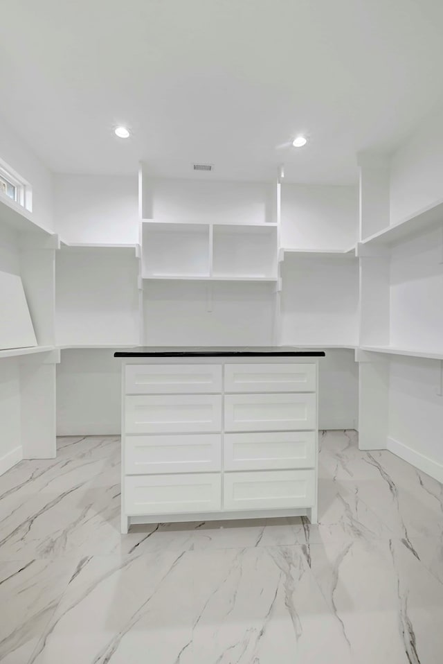 8634 Luz Dr, Odessa, TX 79765 - walk in closet featuring light marble finish flooring
