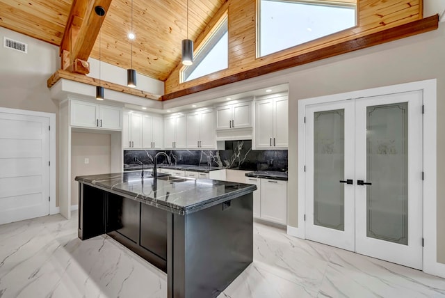 8634 Luz Dr, Odessa, TX 79765 - kitchen featuring a sink, french doors, light marble finish floors, backsplash, and wood ceiling
