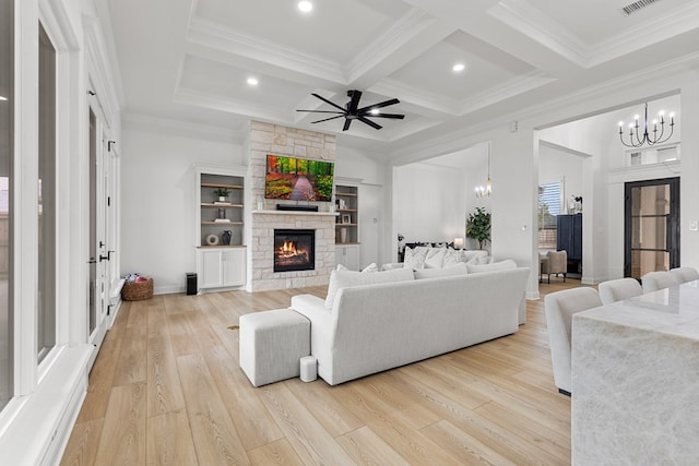 living room featuring light hardwood / wood-style floors, ornamental molding, beam ceiling, and coffered ceiling